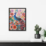 Framed vibrant boho print featuring a stylized blue peacock surrounded by colorful pink, orange, and teal flowers and foliage against a light background, displayed on a white wall with potted cactus and books below.