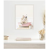 Framed canvas of a mother and baby polar bear cuddling in a soft pink vintage bathtub with a small white pitcher of pink roses nearby.