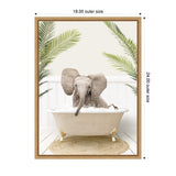 Young elephant sitting in a vintage clawfoot bathtub filled with bubbles, framed by green palm leaves against a white paneled wall with woven round rug beneath.