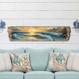 Elongated wooden wall art depicting a coastal scene with crashing waves, rocky cliffs, and a glowing sunset with two sailboats on the horizon.