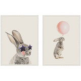 Two framed canvas artworks of a bunny: one with star-shaped sunglasses and pink cheeks, the other holding a pink balloon while standing upright.