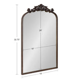 Rectangular mirror with a 19-inch wide base and 28-inch tall glass, topped by an intricately carved dark wood arch with floral and scroll details.