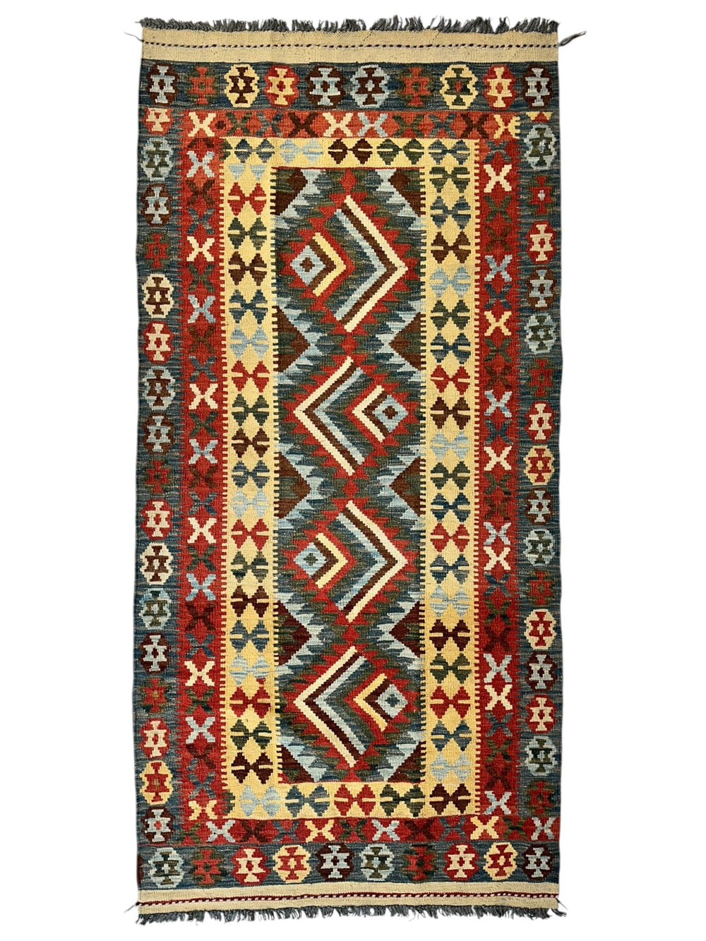 Afghani Maimana Kilim Wide Runner Rug with geometric patterns in neutral and warm tones on a floor