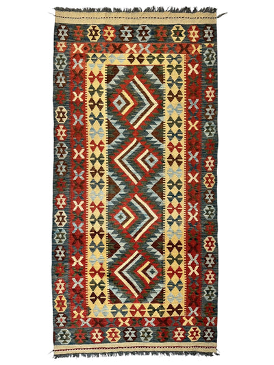 Afghani Maimana Kilim Wide Runner Rug with geometric patterns in neutral and warm tones on a floor