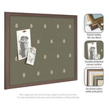 Rectangular olive green pinboard with small white botanical prints and a dark wood frame, displaying two black and white photos pinned to it.