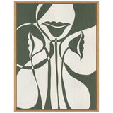 Abstract minimalist artwork featuring dark green and white shapes outlining a partial face with lips and floral elements, framed in light wood.