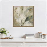 Abstract floral painting with soft olive green, beige, and gray brush strokes, framed in light wood, hanging above a white desk with books, plant, and patterned containers.