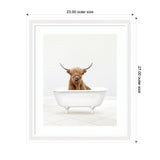 Framed print of a brown Highland cow standing inside a white clawfoot bathtub on a tiled floor with a plain white background.