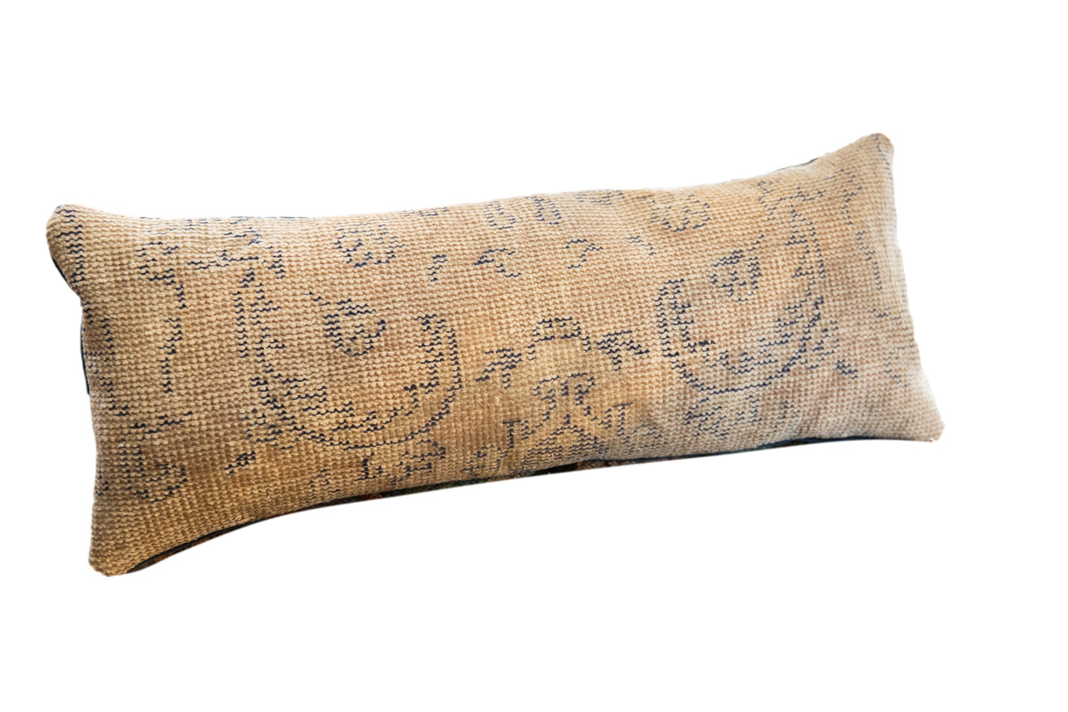 Reclaimed Rug Fragment Pillow featuring vintage woven patterns in muted tones