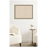 Beige fabric-cork pinboard with a brown wooden frame featuring a simple diagonal lattice pattern with small dark pins at intersections, mounted on a white wall above a brass side table and cream upholstered chairs.