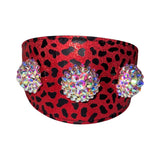 Red collar with black leopard print pattern featuring three large, round Swarovski crystal rivets that sparkle with multiple colors.