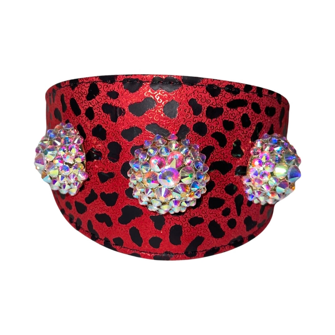 Red collar with black leopard print pattern featuring three large, round Swarovski crystal rivets that sparkle with multiple colors.