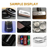 Nine sample laser-marked objects including black wristbands, a metal office sign, a barcode on a metal punch, a branded black cone, engraved phone backs, round tokens with text, a black thermal flask, soda cans, and a silver ring.