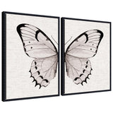 Two framed canvas art pieces featuring minimal butterfly watercolor on neutral linen background with beaded detail