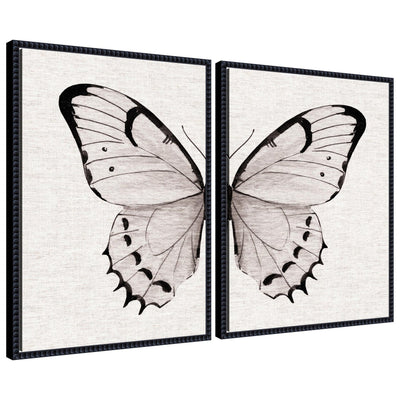 Two framed canvas art pieces featuring minimal butterfly watercolor on neutral linen background with beaded detail