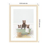 Three brown bear cubs in a pale green clawfoot bathtub with a white towel draped over the side, a wicker basket nearby, and a rubber duck on a round bath mat.