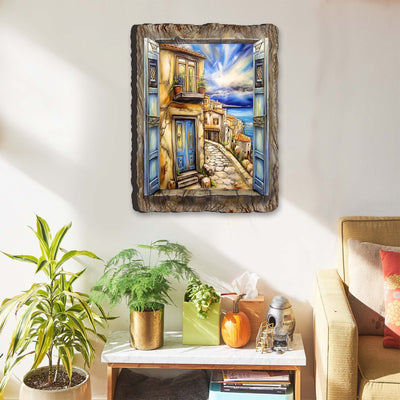 Coastal Town Window View Wall Art by G. DeBrekht showing a seaside landscape in wood with a blue-shaded sky and coastal town scene