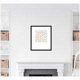 Beige and white abstract organic shapes in a square format framed in black, centered above a white fireplace with built-in shelves on each side.