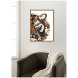 Framed artwork of a tiger's face in close-up, using layered brown, black, white, and beige textures for fur detail, hanging above a dark green armchair with a knitted beige throw.