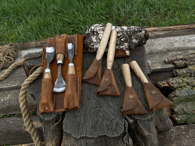7-piece hand-forged wood carving tool set with ash wood handles and leather cases