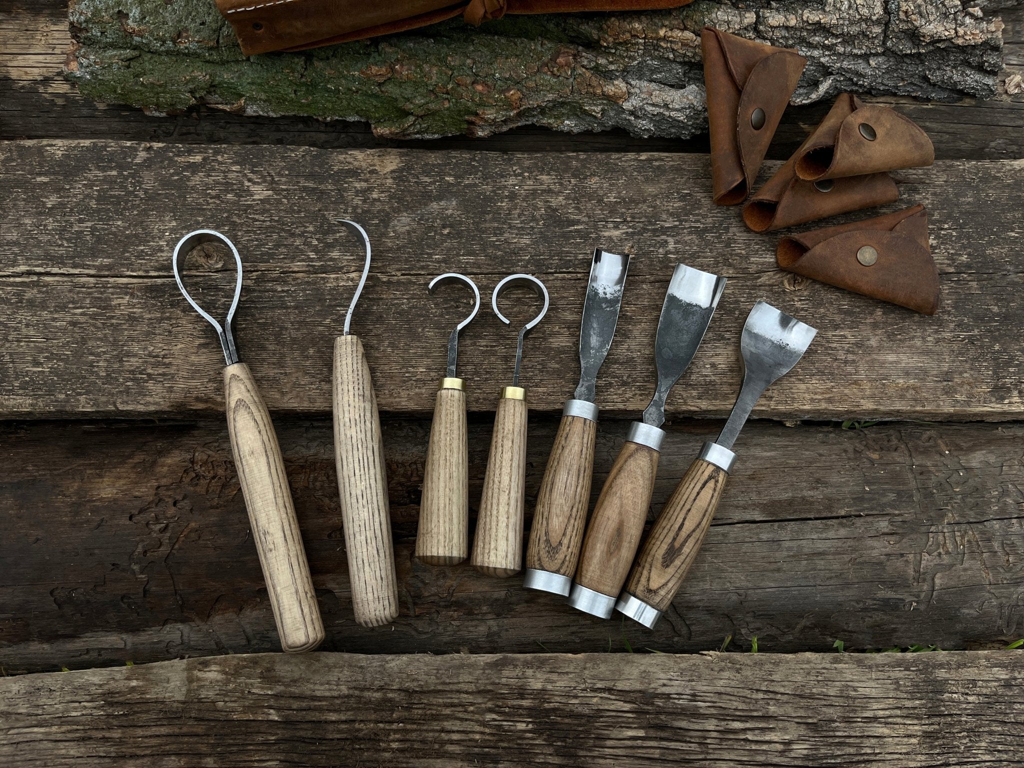 7-piece hand-forged wood carving tool set with ash wood handles and leather cases