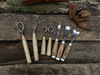 7-piece hand-forged wood carving tool set with ash wood handles and leather cases