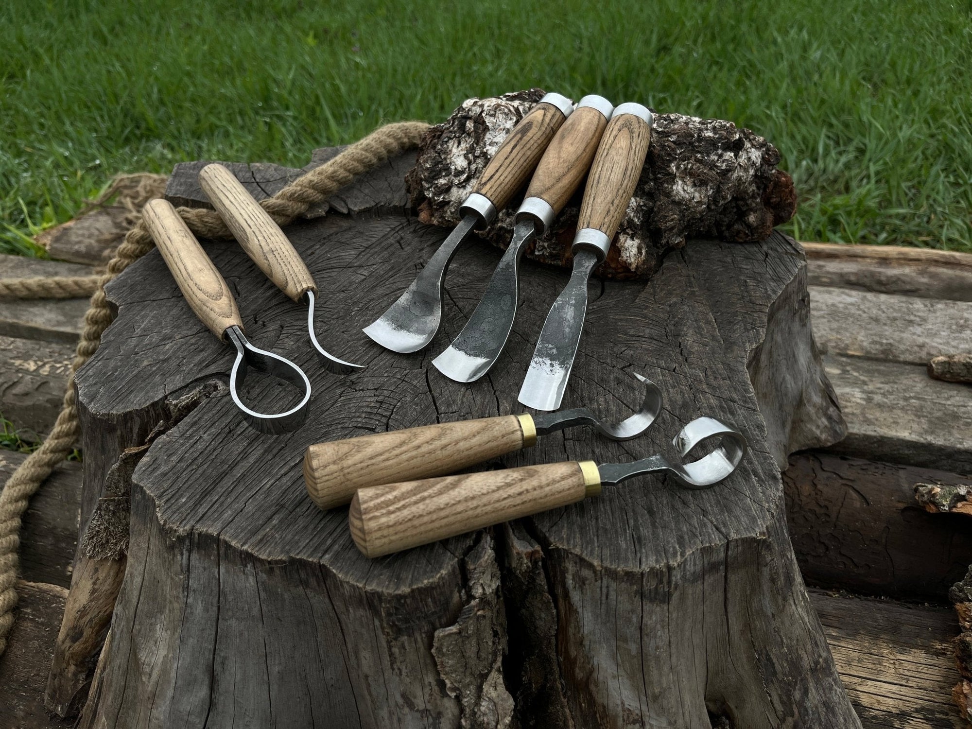7-piece hand-forged wood carving tool set with ash wood handles and leather cases