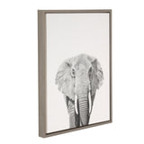 Framed canvas print of a black and white elephant portrait facing forward with large ears and long tusks on a white background.