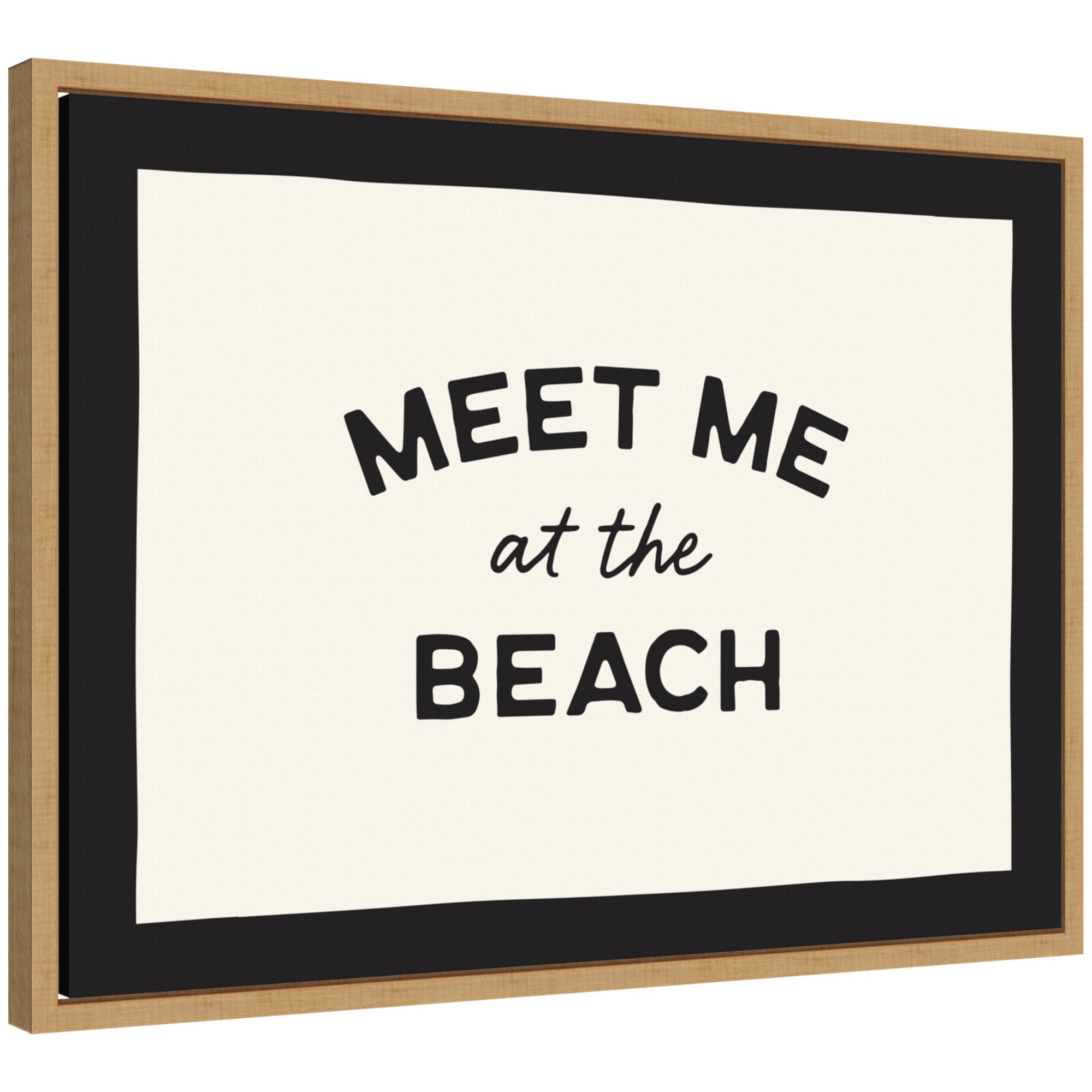 Framed canvas wall art with text 'Meet Me at the Beach' in natural tones, styled with neutral decor.
