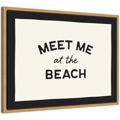 Framed canvas wall art with text 'Meet Me at the Beach' in natural tones, styled with neutral decor.