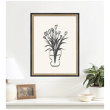 Black and white minimalist print of stylized tulips in a uniquely shaped vase with a decorative black and gold patterned frame, hanging on a white wall.