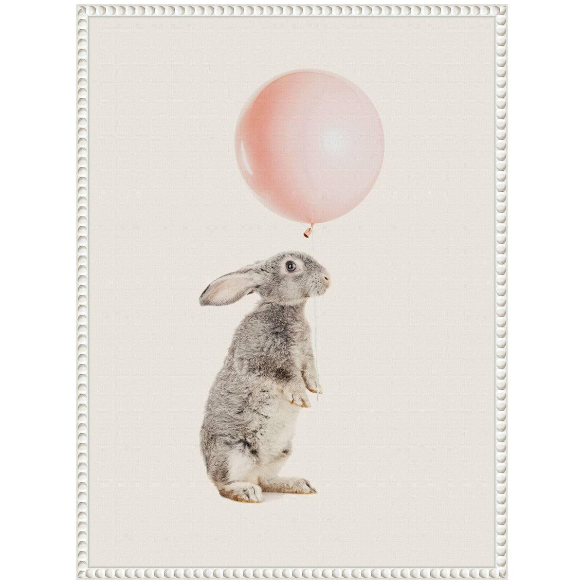 Gray rabbit standing on hind legs holding a large pink balloon string against a cream background with a decorative white frame.