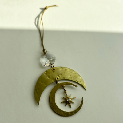 Love and Stardust Ornament handcrafted of brass with vintage glass crystal hanging on wall