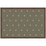Rectangular block print textile with olive green background and evenly spaced small white botanical motifs, framed by a brown wooden border.
