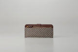 Slim Zipped Long Wallet - New Grecian by Inden showing white hand-drawn pattern on gray leather exterior with zipper detail