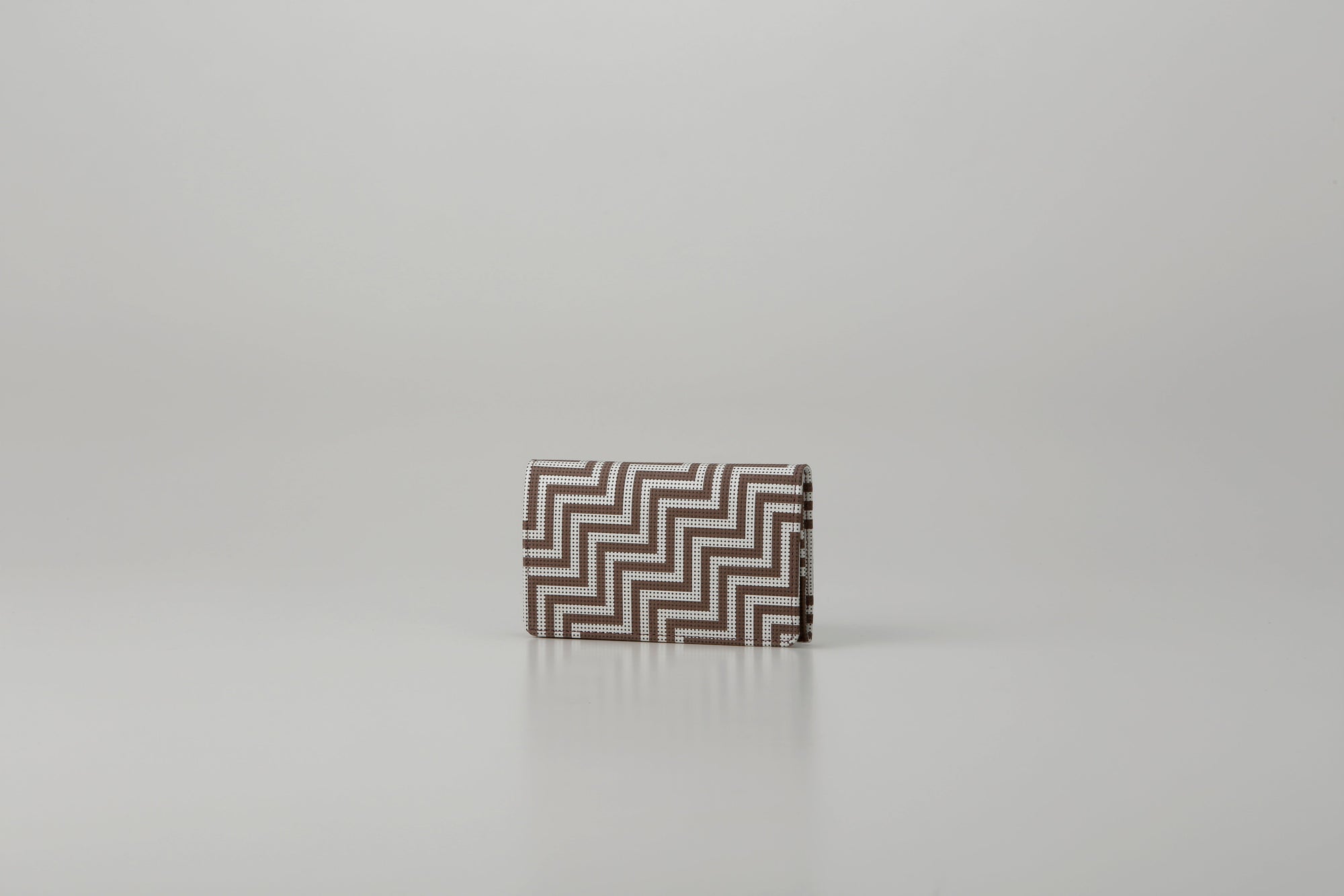 Business Card Case - New Grecian by Inden showing greige deer leather with white hand-drawn pattern and gray lacquer dots