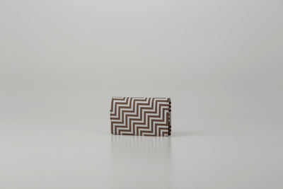 Business Card Case - New Grecian by Inden showing greige deer leather with white hand-drawn pattern and gray lacquer dots