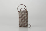 New Grecian leather phone case with white hand-drawn pattern and gray lacquer dots, equipped with detachable strap.