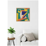 Abstract framed canvas with bold blue, orange, yellow, and green geometric shapes on neutral linen, hanging above a white sofa with beige cushions and a small plant on a round wooden side table.