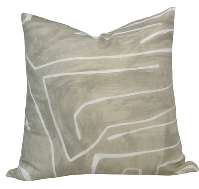 Cream and beige abstract patterned linen pillow cover displayed on a couch