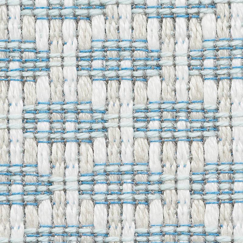 Close-up of woven fabric with thick white yarns interlaced with fine sky blue threads forming a grid pattern, showing textured, chunky weave detail.