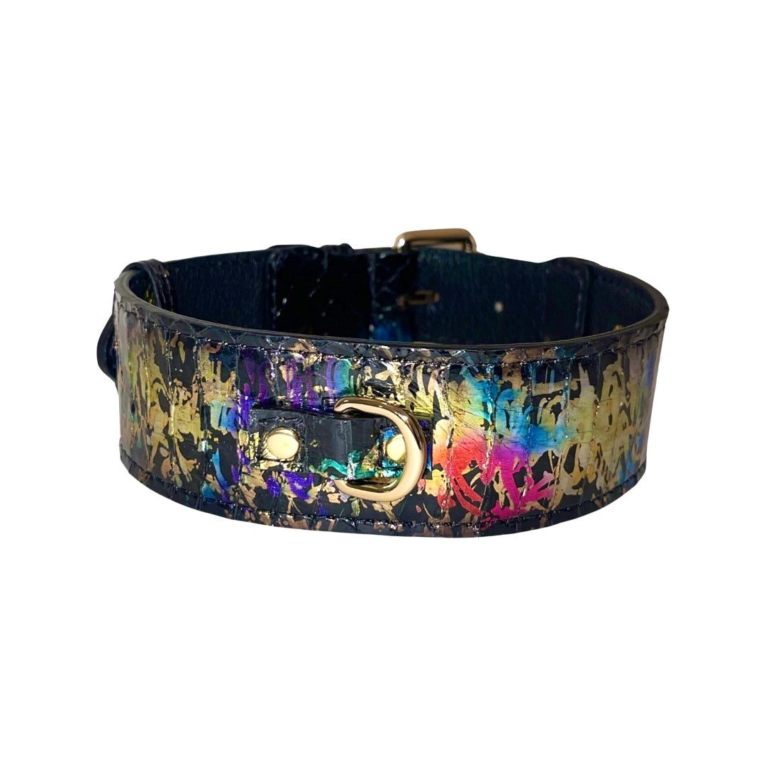 Wide black leather collar with colorful rainbow and gold abstract snake pattern and gold D-ring hardware, shown flat on white background.