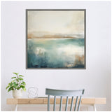 Square abstract canvas painting depicting a calming lake with blended blue, beige, and light brown hues, hung above a minimalist desk with a plant and sculpture.