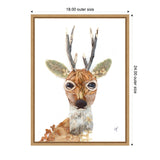 Canvas wall art print depicting a stylized buck's head with large eyes, textured brown fur, and green leafy antlers, framed in light wood measuring 18 by 24 inches.