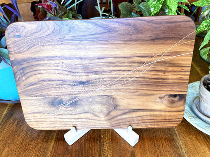 Walnut charcuterie board with Cherry and Maple decorative banding, handcrafted by Fitzgerald Custom Woodcraft