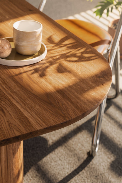 Oval solid wood dining table with chestnut wood finish and custom solid wood legs
