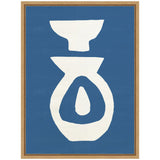 Framed canvas artwork with bold white abstract ceramic shapes on a blue background, featuring a bowl-like form above a vessel with a teardrop center.