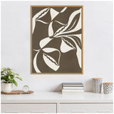 Abstract botanical canvas with flowing dark brown and white organic shapes framed in light wood, hanging above white dresser with plants and patterned containers.
