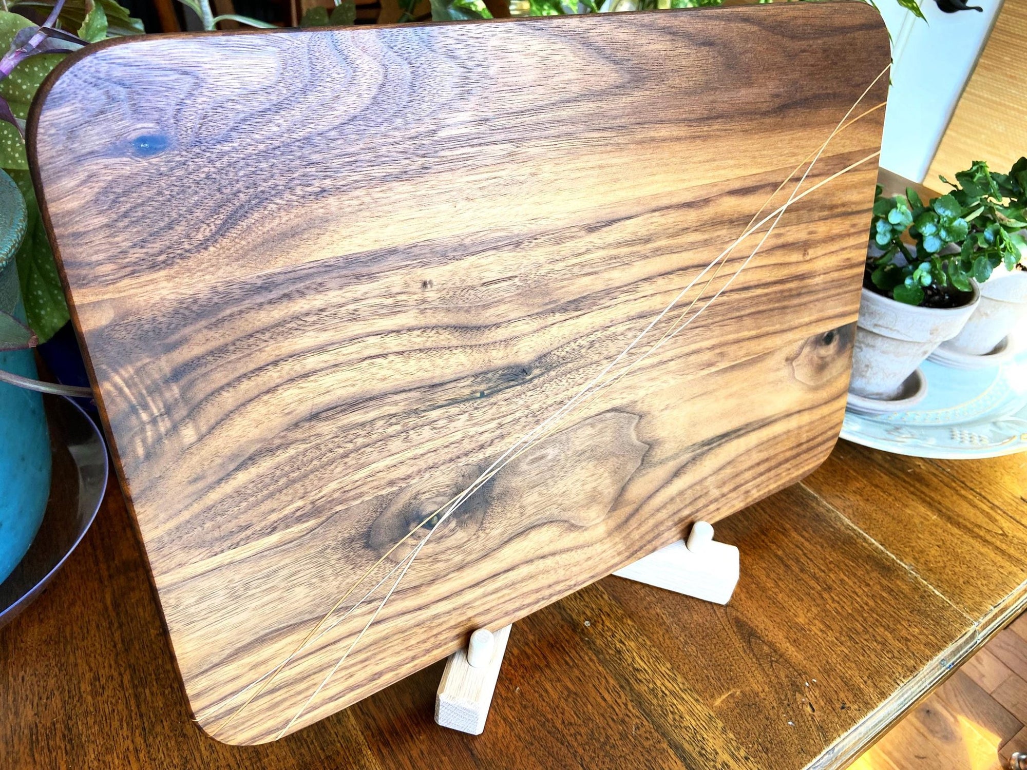 Walnut charcuterie board with Cherry and Maple decorative banding, handcrafted by Fitzgerald Custom Woodcraft