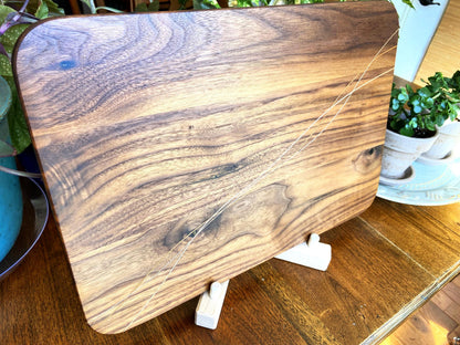 Walnut charcuterie board with Cherry and Maple decorative banding, handcrafted by Fitzgerald Custom Woodcraft